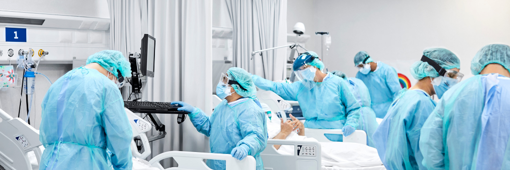 Doctors and nurses wearing protective coveralls at a hospital during covid-19