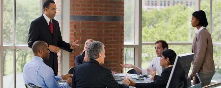 A group of business people around a table