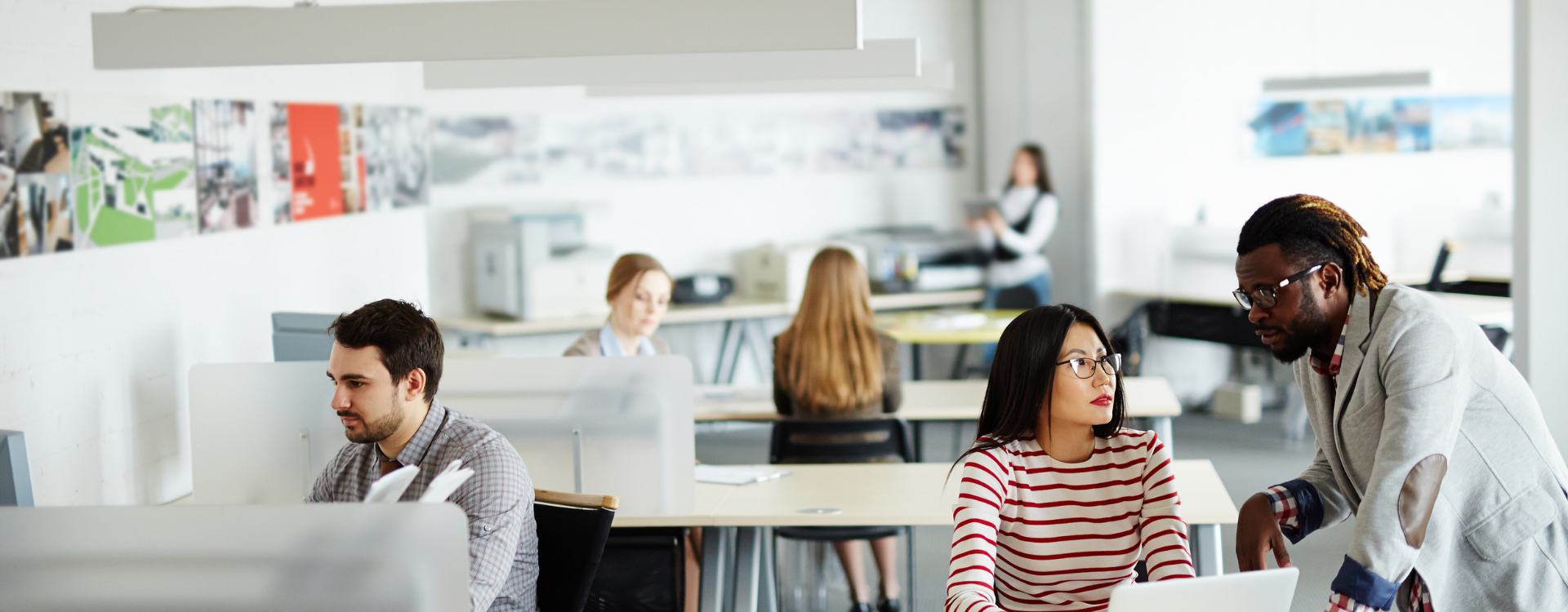 A group of people in an office environment