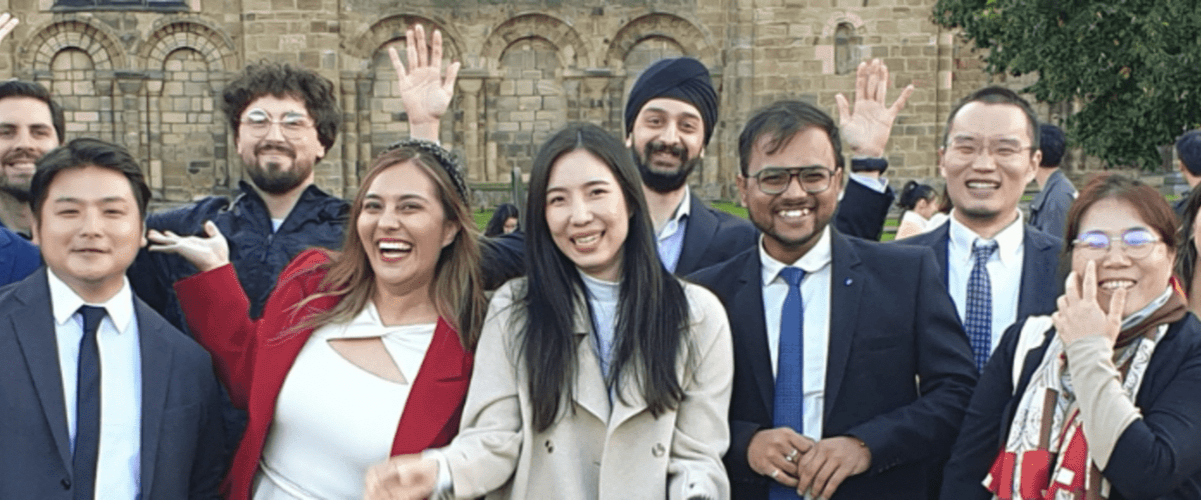 A group of alumni outside of Durham Cathedral