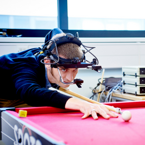 Participant in research study with head monitoring equipment