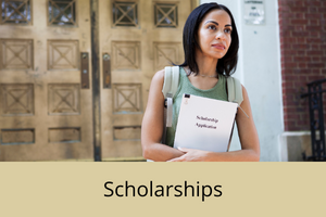 A woman holding a scholarship application form across her chest