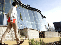 Man walking outside the business school courtyard