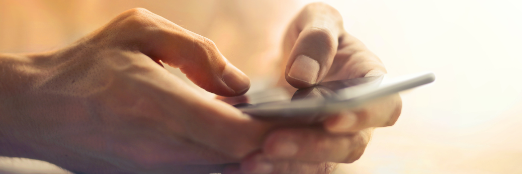 Close up picture of a man using his mobile phone