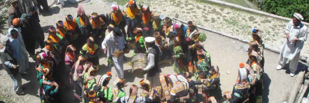 Kalash people dancing on rooftop in Pakistan