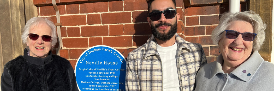 Former Neville House students Christine Middleton and Ruth Rowntree standing with Joel Lozano beside the blue plaque