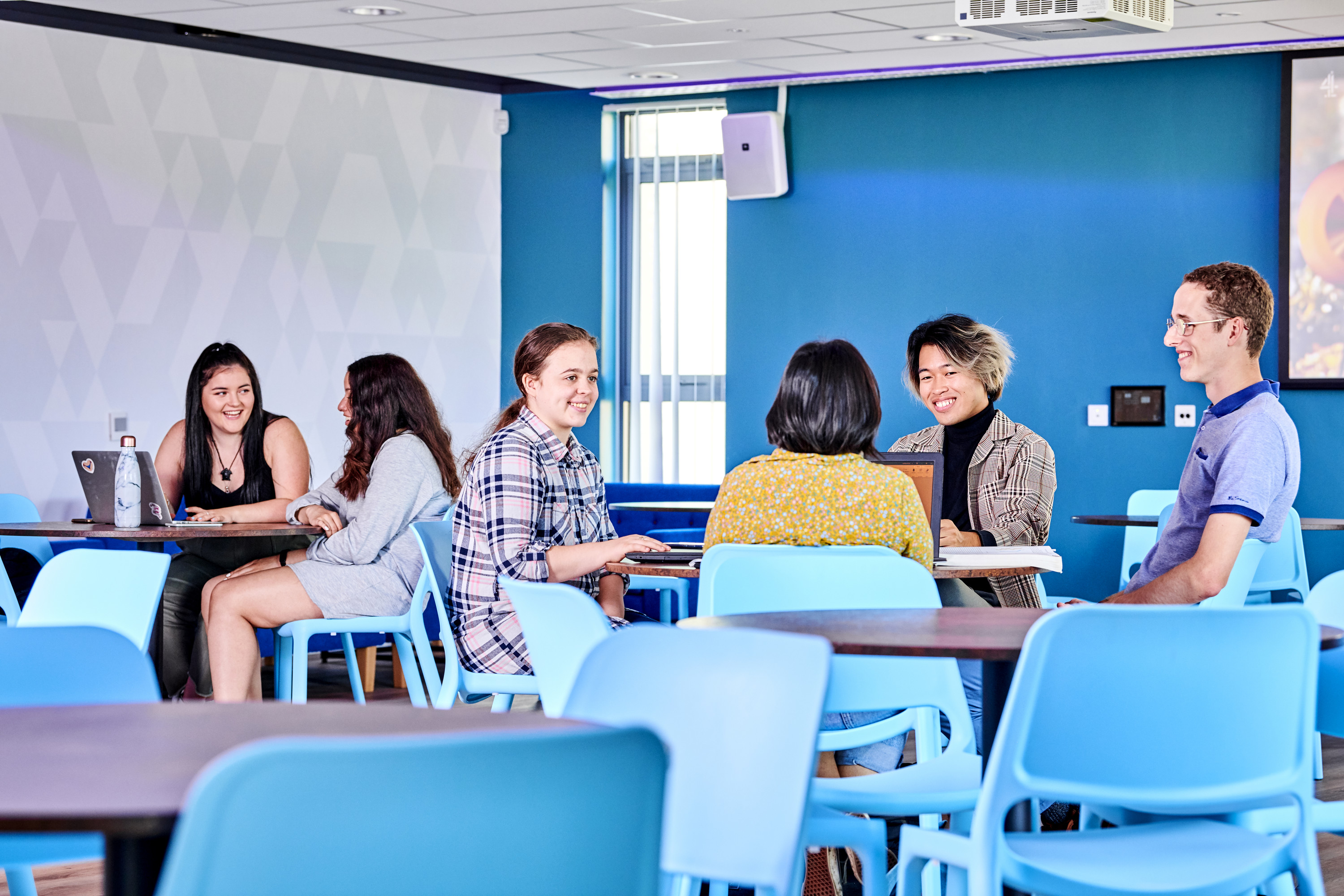 Students sitting in South College Social Space