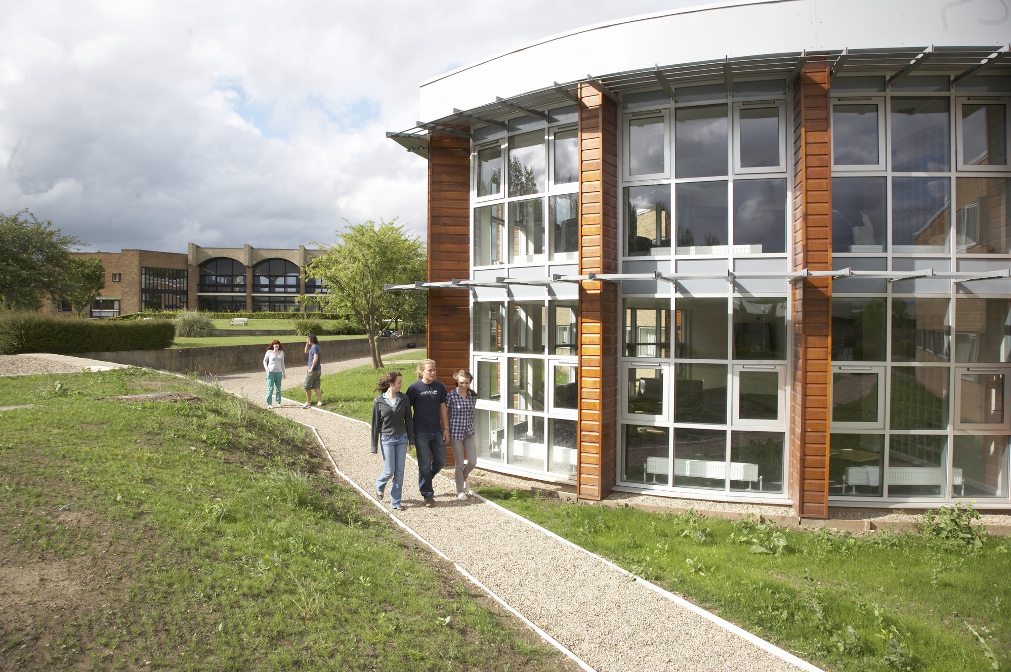 St Aidan's College exterior with people