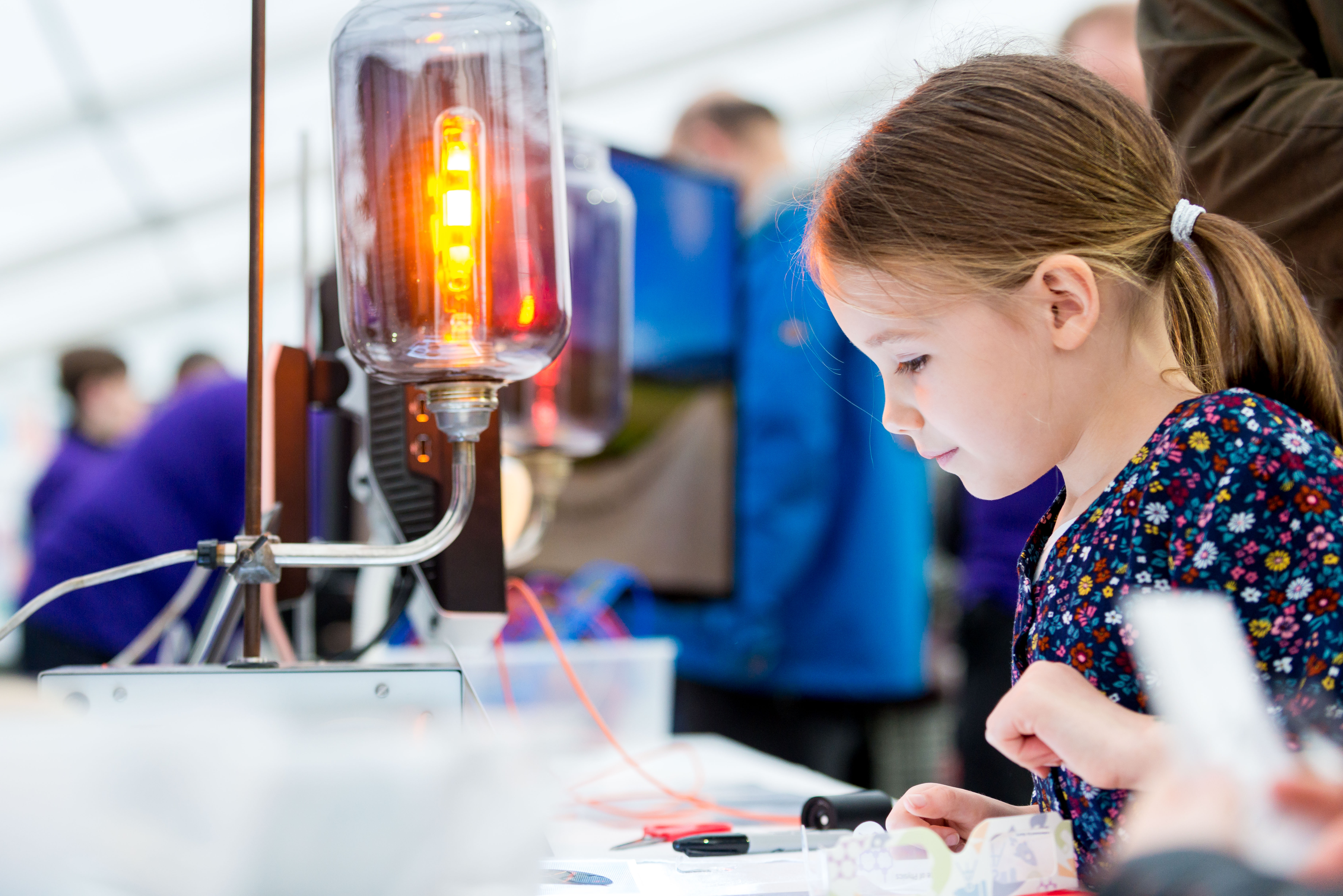 A little girl testing an experiment