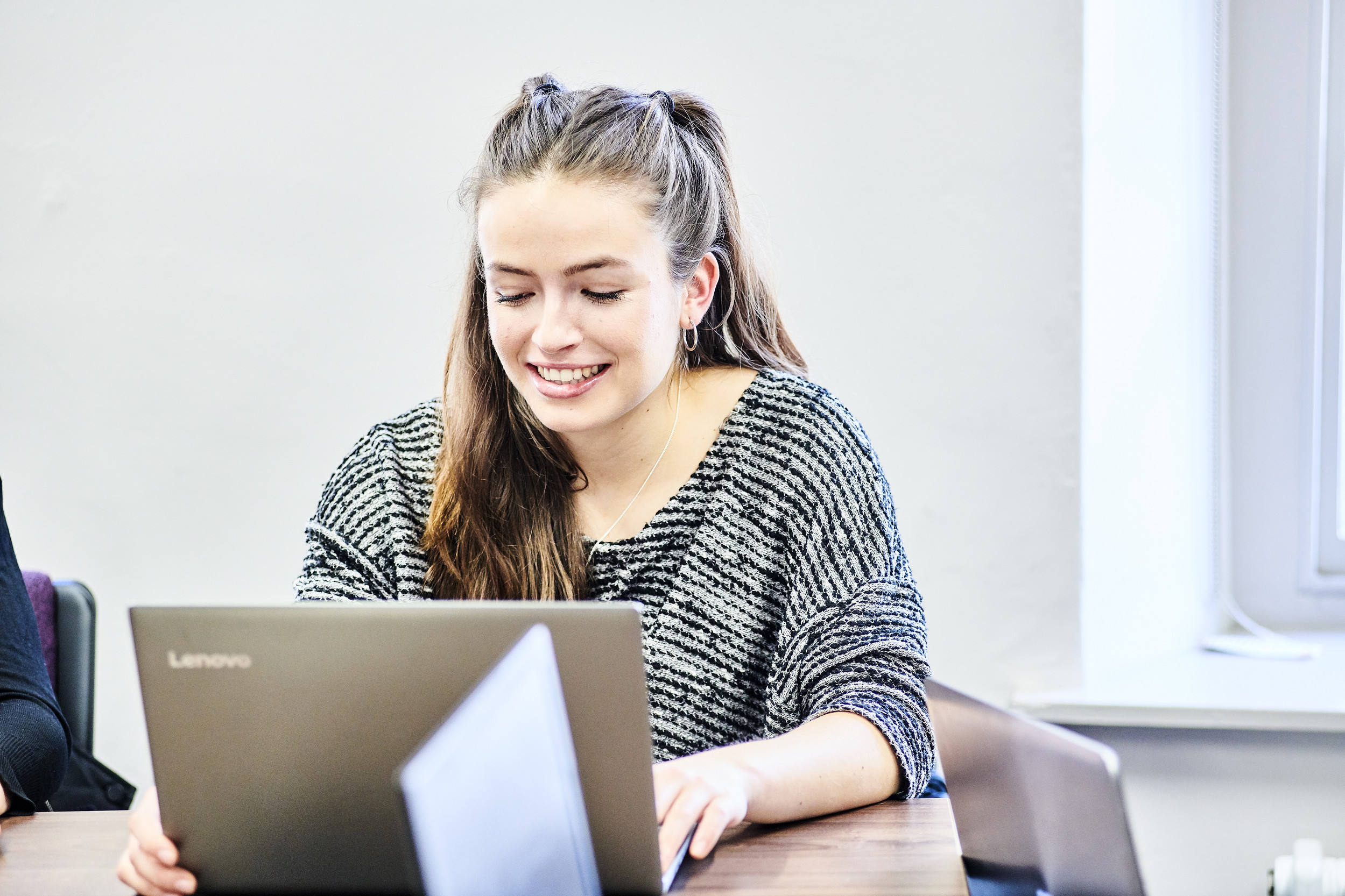 A student working on a laptop