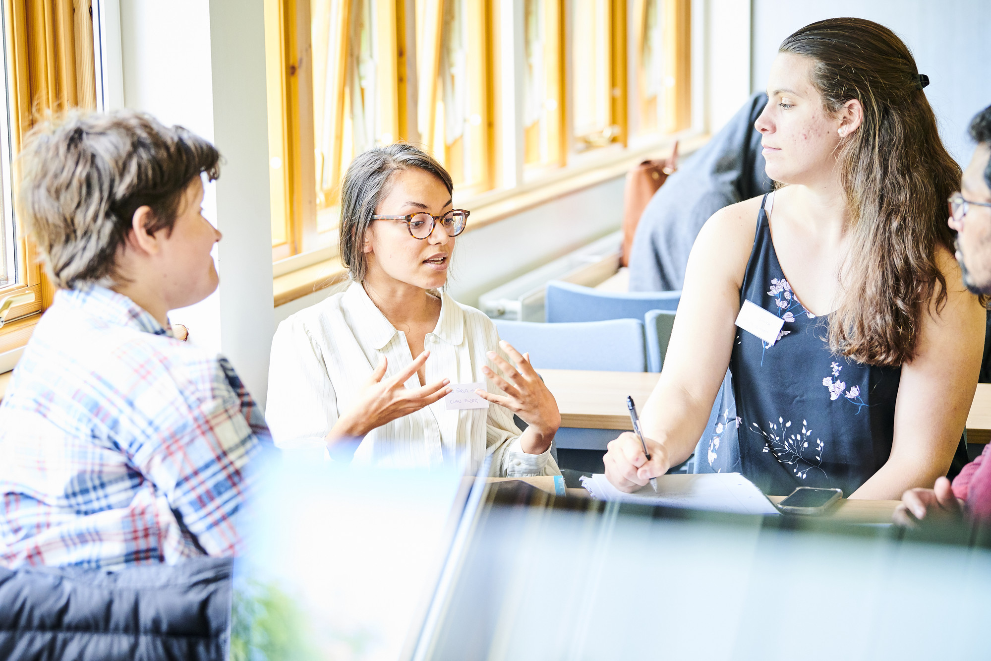 Four students having a group discussion