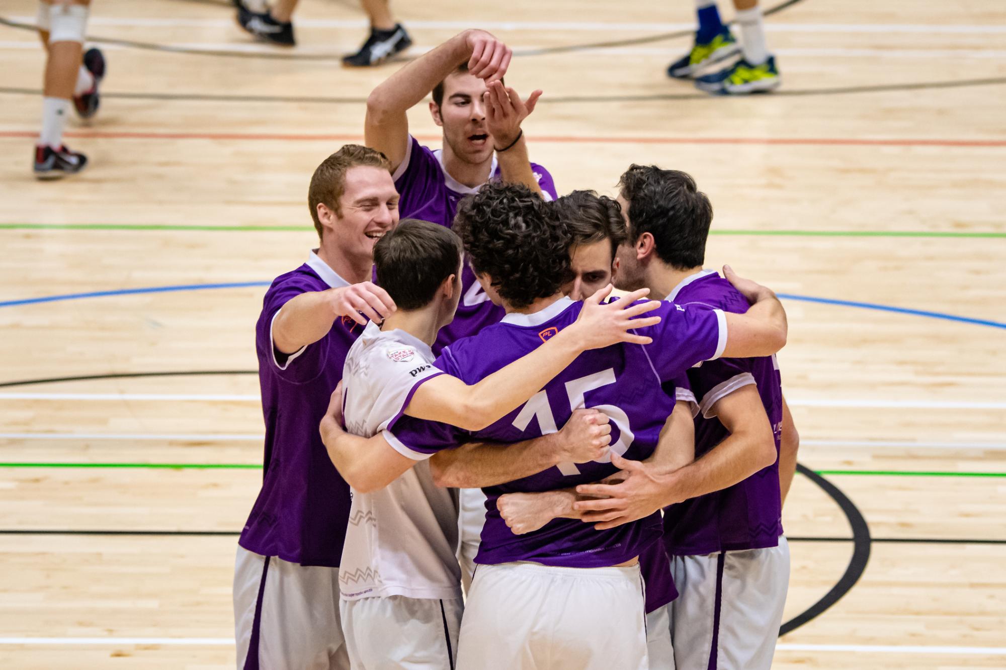 A sports team in a huddle