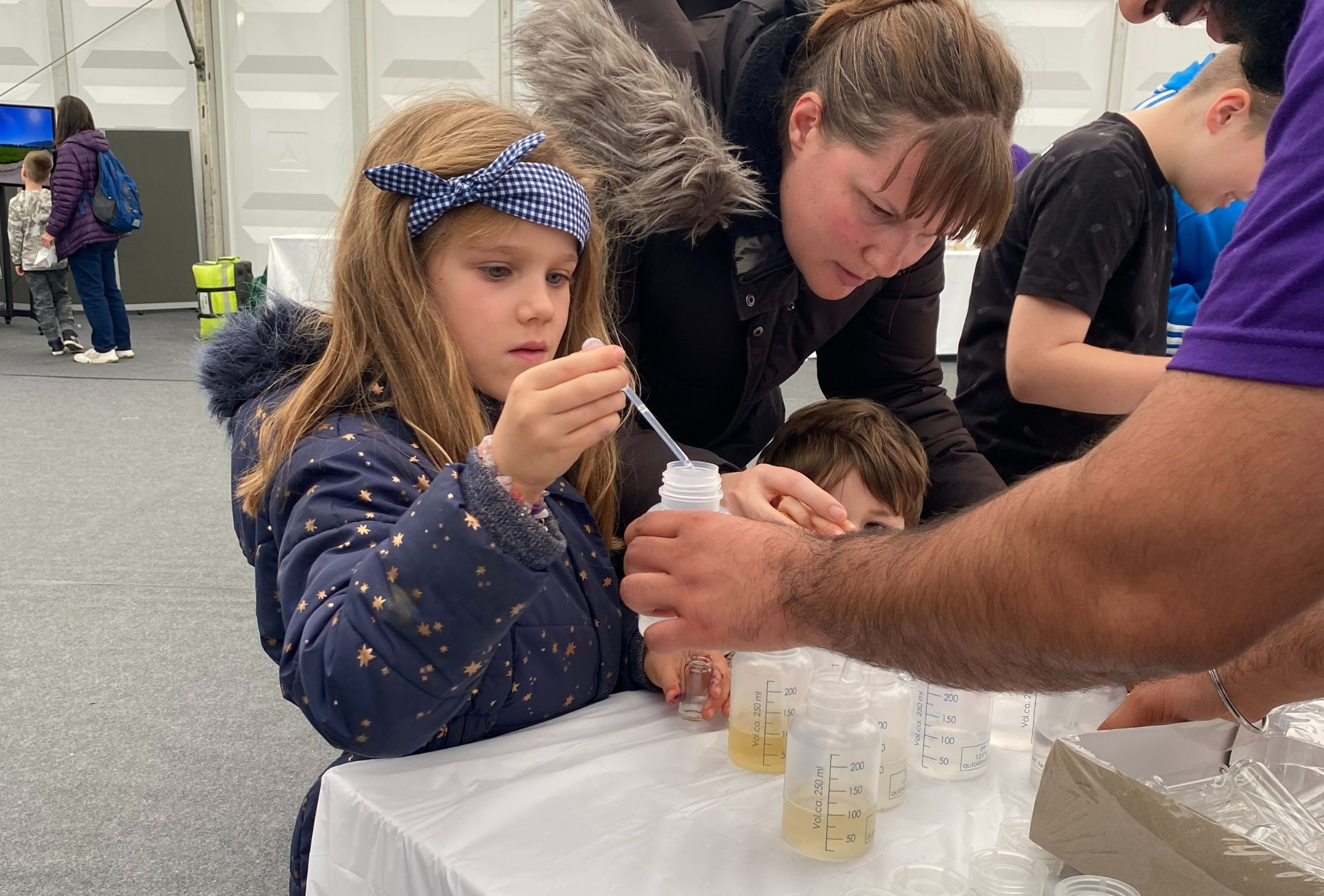 A girl experimenting perfume scents with Procter & Gamble