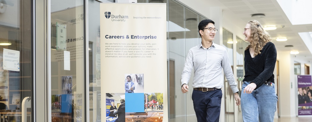 Two students walking into the Careers Office in teh Palatine Centre