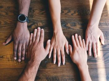 Hands together on the table