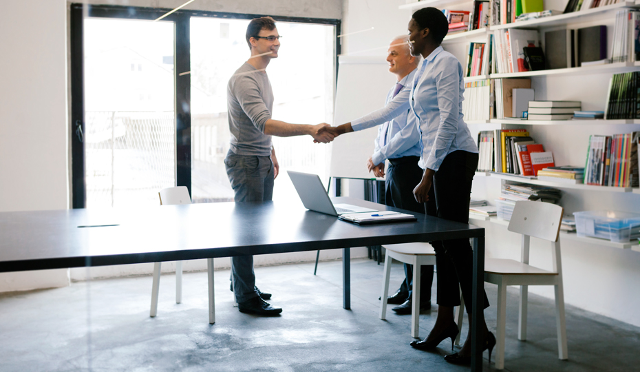 People shaking hands during a job interview