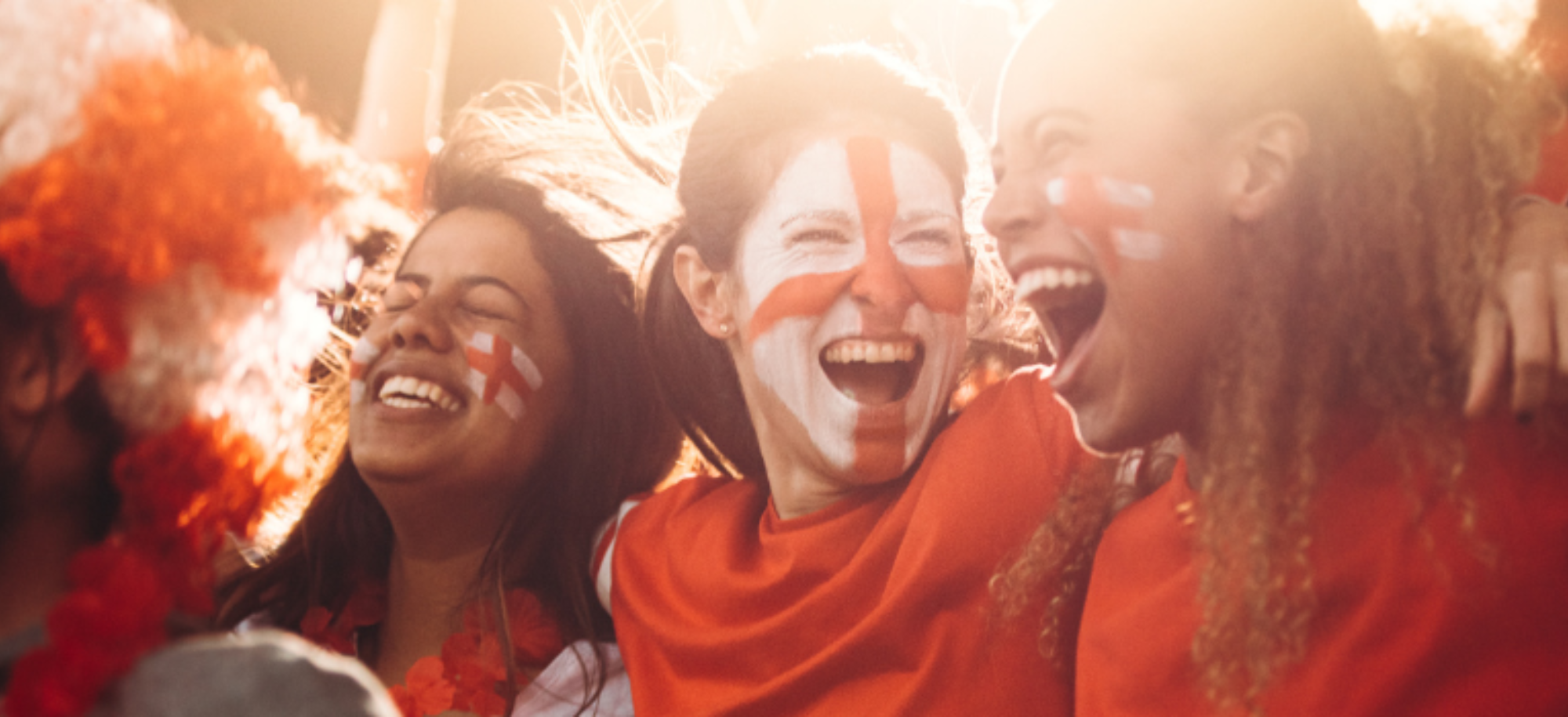 Women enjoying an England football match.