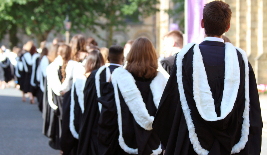 Congregation on The Peninsula with students dressed in graduation gowns