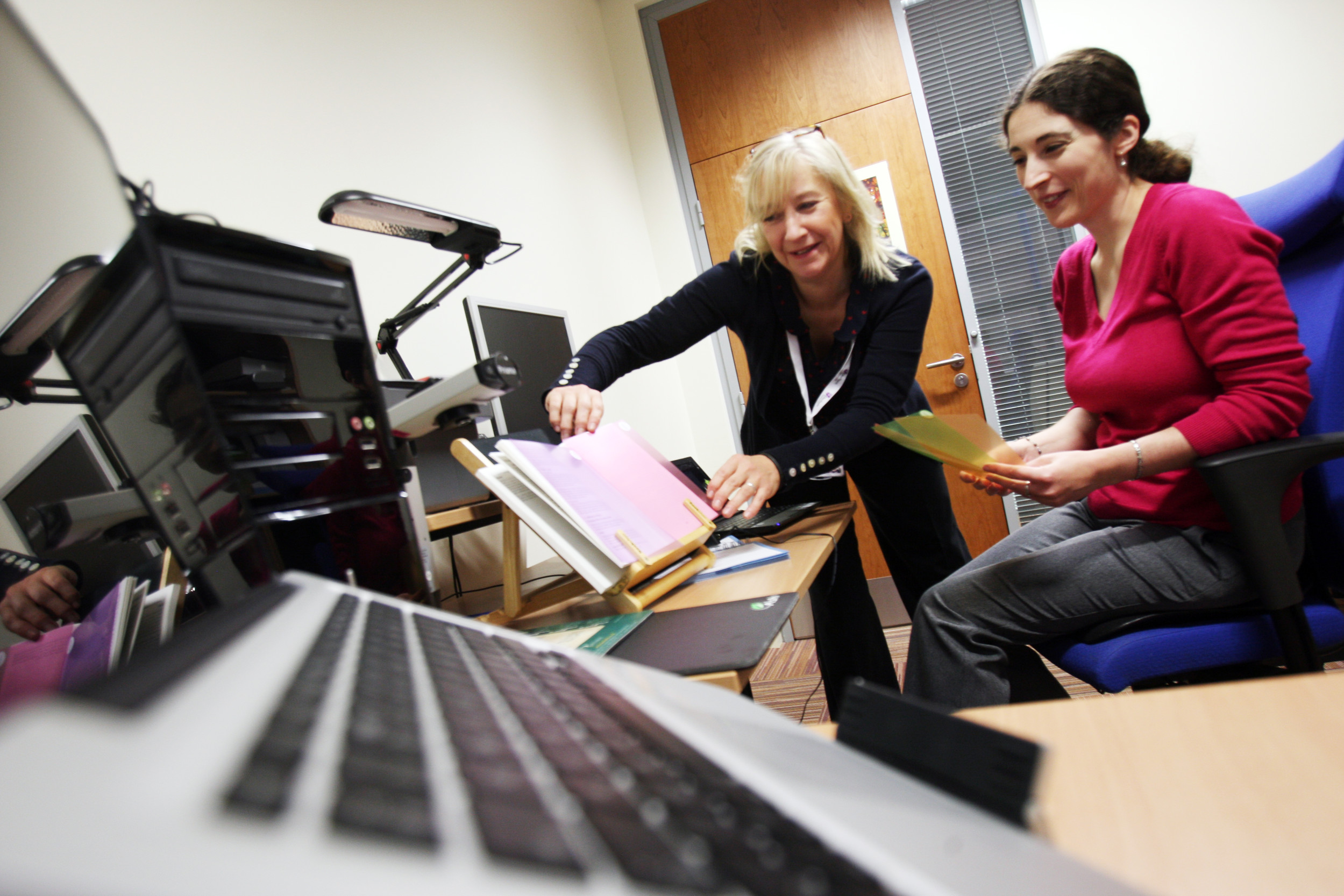 Staff member assisting a student