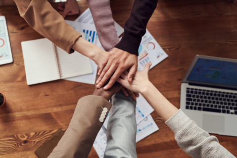 Group of hands on top of each other